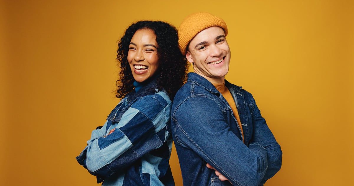 Portrait of a couple in studio with arms crossed